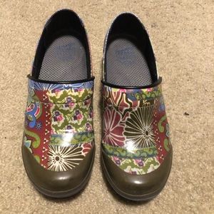 Dansko waterproof multicolored clogs.
